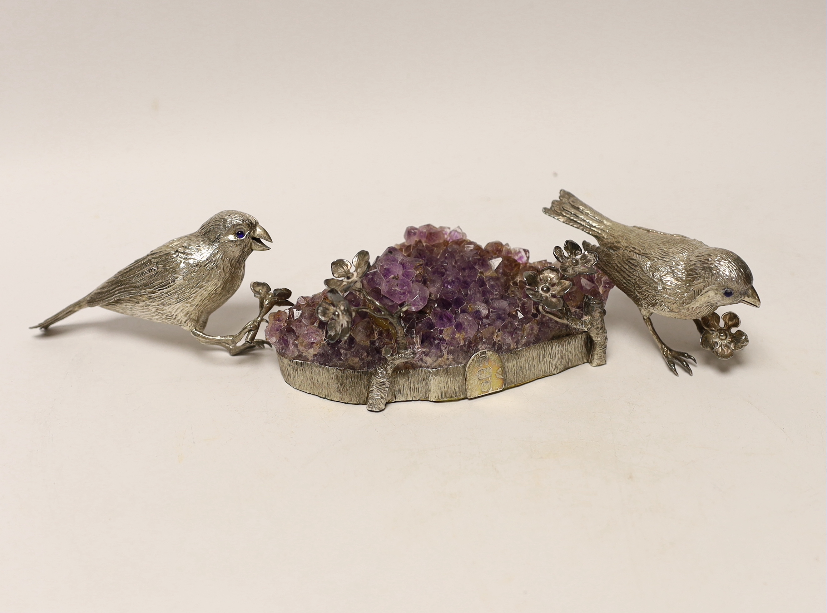 An Elizabeth II silver mounted quartz geode, maker CJ, London, 1977, 14cm with two detached unmarked model birds.